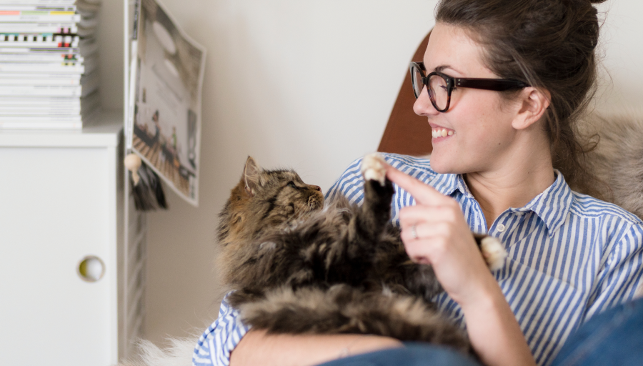 A woman playing a cat